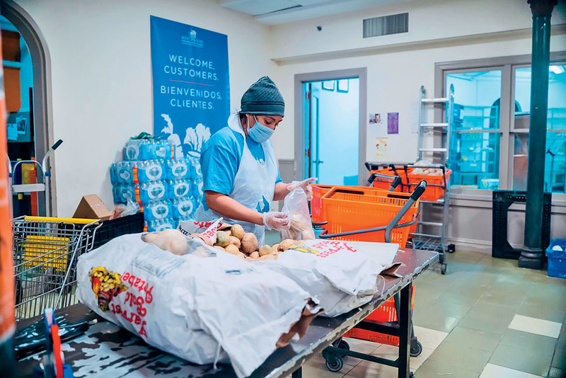 A person preparing food deliveries at the West Side Campaign Against Hunger, a Columbia-supported nonprofit